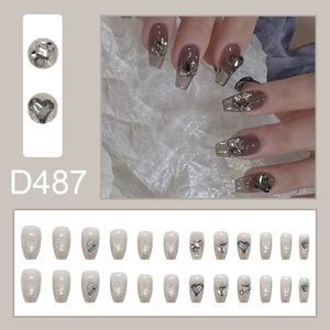 Detail of D487 press-on nails featuring grey gradient with rhinestones and 24pc set