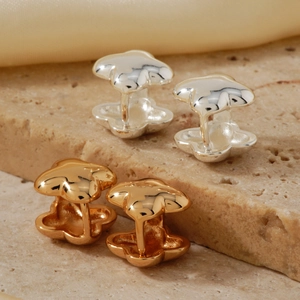 Minimalist four-leaf clover stud earrings in gold and silver finish on stone base