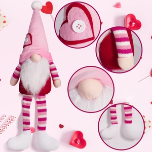 Cute Valentine long-leg gnome plush with heart details and striped knits on pink background