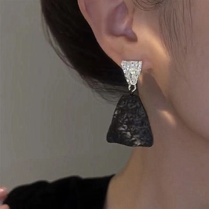 Minimalist silver-tone textured metal earrings with black matte trapezoid drop pendants