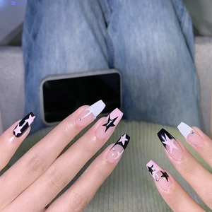 Long coffin fake nails with french tip star patterns and small rhinestones