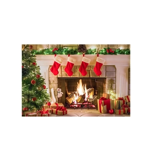 Christmas fireplace backdrop with red stockings decorated tree and gift boxes
