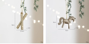 Champagne gold ski poles and rocking horse ornaments hanging on Christmas tree branches