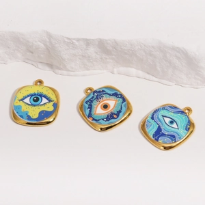 Three square golden evil eye charms with colorful oil painting designs on stone