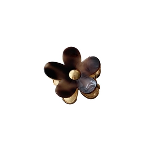 Elegant amber flower hair claw clip made of acetate with a durable gold metal shark clip