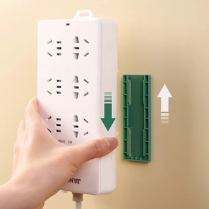Wall-mounted power strip holder with sliding rail for punch-free cable management
