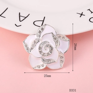 Close-up of a 26mm white enamel camellia flower charm with rhinestones and size labels