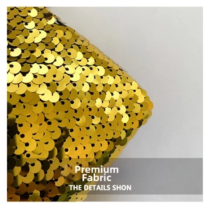 Macro shot of high-density gold sequins with metallic reflective texture on bucket bag