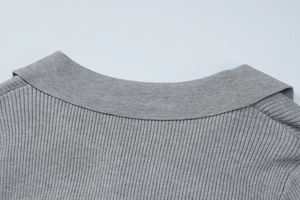 Close-up of gray ribbed knit collar on the polo neck dress showing high-quality texture