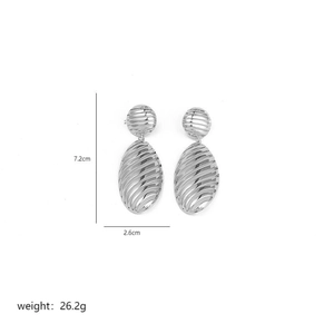 Detail view of large silver oval earrings showing size dimensions 7.2cm x 2.6cm and weight