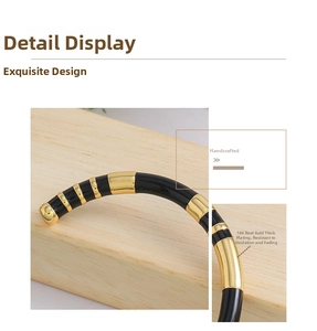 Detail of 18K gold plated bamboo texture bangle with durable enamel finish