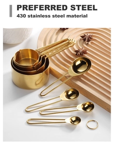 Close-up of golden 430 stainless steel measuring cups and spoons with wire handles
