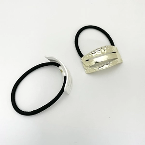 Minimalist elastic hair ties with wavy gold and silver hammer-textured metal accents