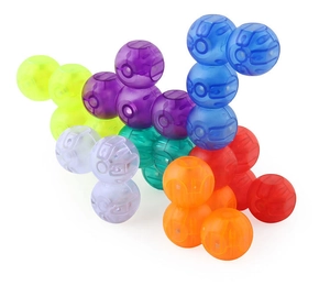 Macro shot of colorful translucent interlocking magnetic blocks in 3D spherical shape
