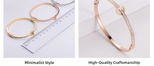 Macro detail of heart-shaped clasp bangles with LOVE FOREVER engraving and pave crystals