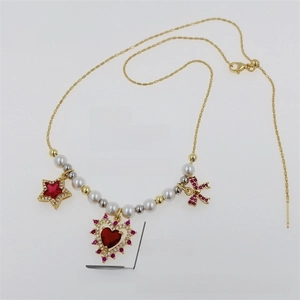 Detailed macro view of 18K gold plated copper necklace with zircon and pearls