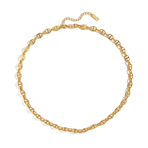 Detailed close-up of golden stainless steel heart-knot link necklace with S.Steel tag