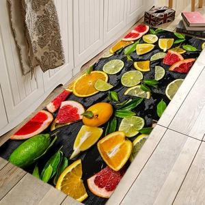 Detailed view of kitchen runner mat with citrus fruit print on black wood background