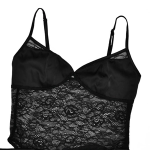 Detail of black lace and satin bodysuit with adjustable spaghetti straps on white background