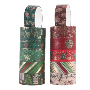 Vista dettagliata del set washi tape natalizio con motivi festivi rosso-verdi e lamina d'oro