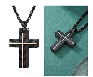 Detail of cross pendant featuring black carbon fiber texture and rose gold steel inlay