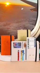 Detail view of RFID blocking passport holder with interior slots and elastic strap