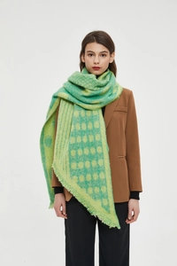 Close-up of green geometric plaid scarf with soft fringe edges for women winter wear