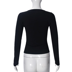 Detail view of the lace-up back design on a fitted long-sleeve black shirt for women