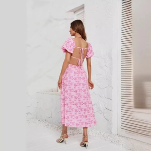 Pink floral midi dress with puff sleeves and lace-up open back design shown from behind