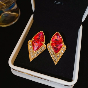 Vintage gold stud earrings with pink triangle crystals and white rhinestones in a gift box