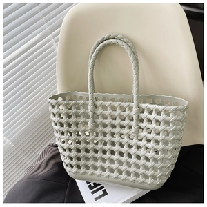 Detailed shot of mint green woven jelly tote bag resting on a chair for summer vacation