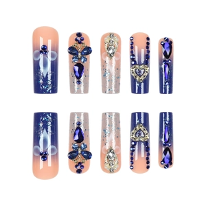 Starry gradient blue and pink press-on nails with 3D butterfly and rhinestone accents
