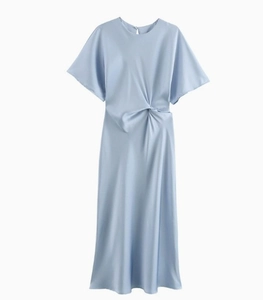 Detail shot of blue satin dress featuring twisted knot waist and smooth silky texture