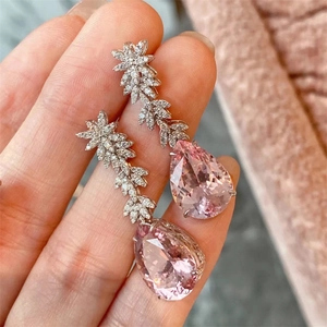 Elegant long drop earrings with pink water-drop gemstones and silver floral leaf accents