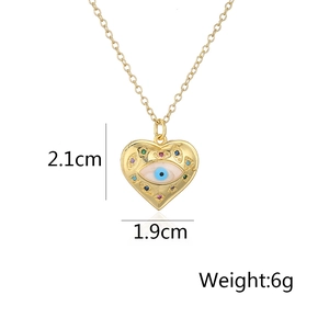 Detail showing 2.1cm x 1.9cm gold heart evil eye pendant with measurements and 6g weight