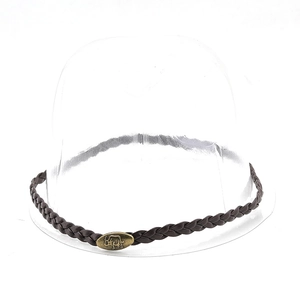 Detail of dark brown braided leather hat band with vintage bronze bull buckle decoration