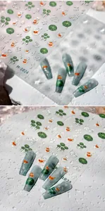 Close-up of M-1024 nail art stickers featuring 3D goldfish and lotus leaf embossed designs