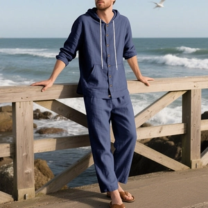 Detail of navy linen beach set featuring wood buttons and drawstring hooded shirt
