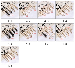 Detailed view of assorted pearl safety pins with size markers on silk fabric background