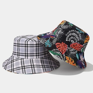 Wide brim sun hat with classic checkered pattern and tropical leaf print design