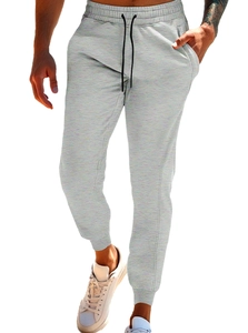 Close-up of drawstring waist and grey cotton-blend fabric on men's jogger pants
