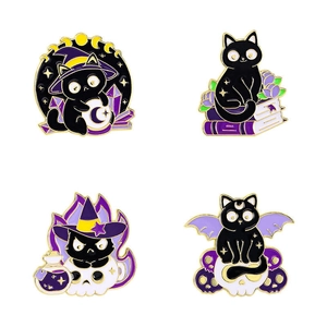 Set of four gothic black cat enamel pins with magic spell books and skulls motifs