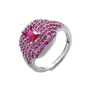 Macro shot of a square pink gemstone cocktail ring with a paved crystal setting