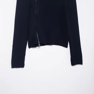 Women's dark blue ribbed knit sweater featuring a stylish asymmetric metal zipper