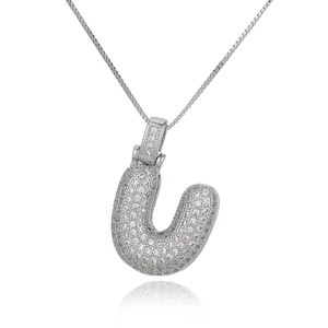 Detailed view of silver letter U pendant with micro-paved cubic zirconia on a box chain