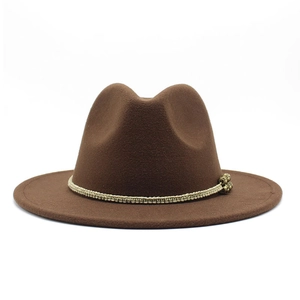 Detail of dark brown wool fedora hat with beige braided rope and antique metal bead accent