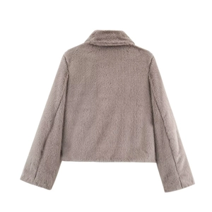 Flat lay back view showing the plush texture of this faux fur cropped jacket in taupe