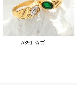 Macro shot of gold-plated Egyptian style rings with clear and green zircon gemstones
