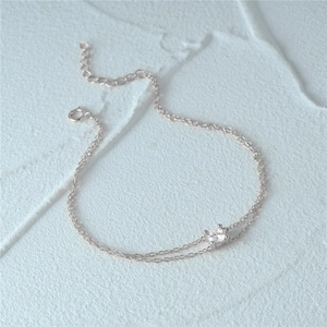 Detail of s925 silver double-layer bracelet with four-prong set round zircon and lobster clasp