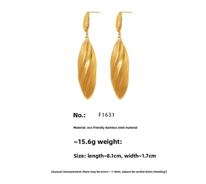 Detailed view of long spiral teardrop earrings in gold-plated stainless steel